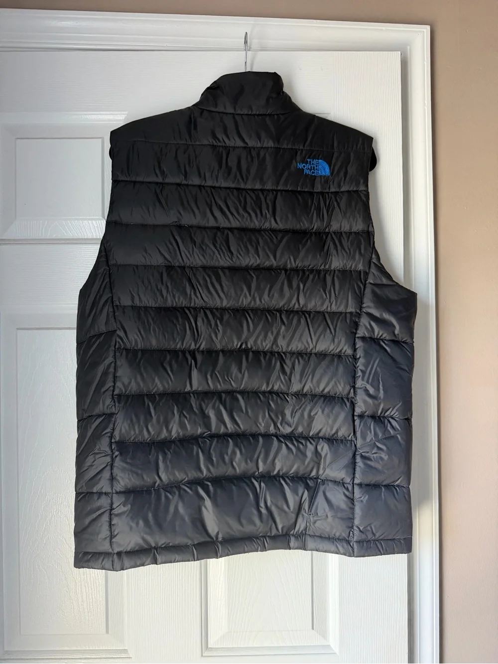 The North Face Black Quilted Down Vest with Blue Zippers